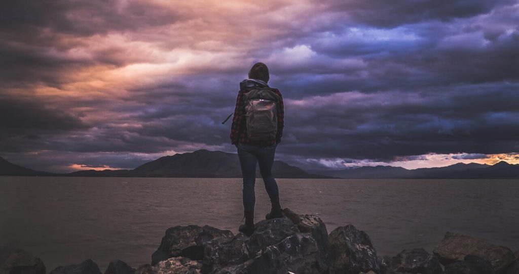 Women solo traveler with carry-on bag