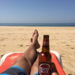 Portugal beach with beer in hand