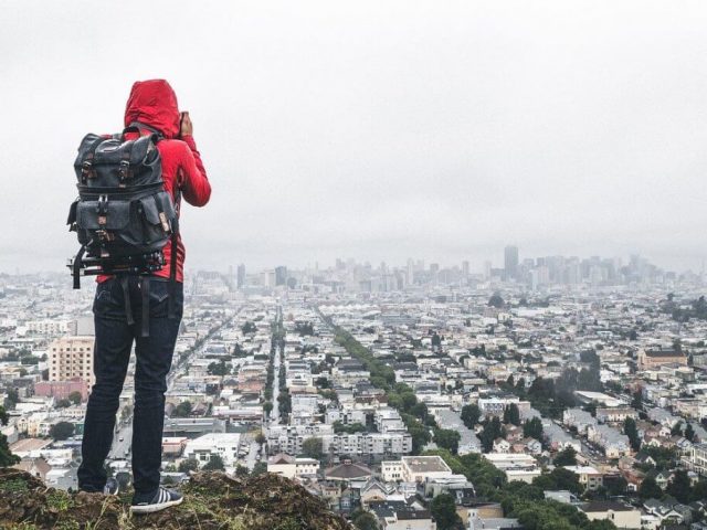 backpacker with backpack for camera take photos