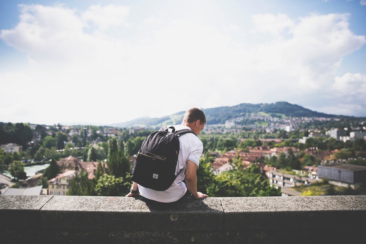 man with a small packable daypack for travel