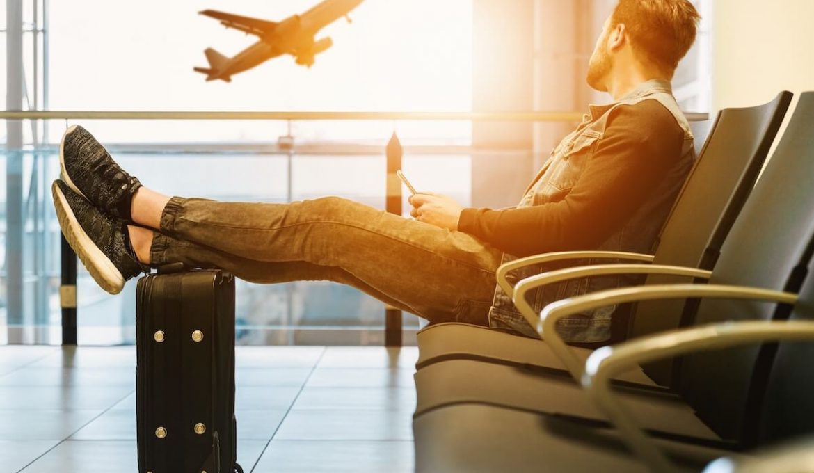 man sitting in airport