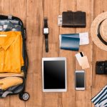 flat lay of solo trip travel items