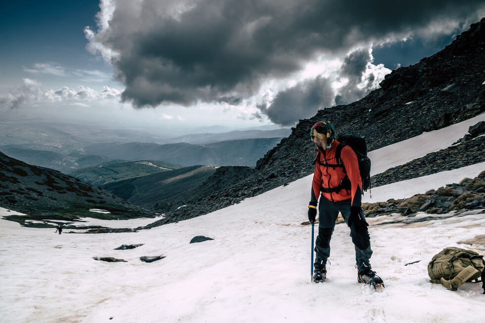 man climbing on mountain