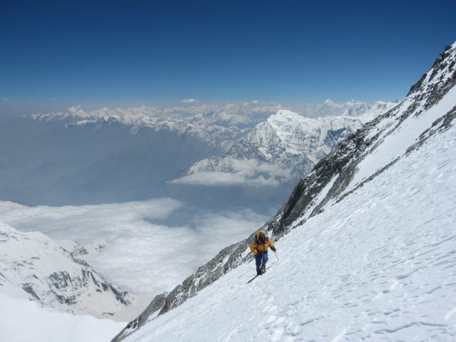 person treks on mountain